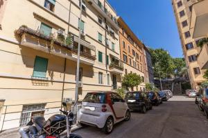 a small car is parked next to a building at Trilocale indipendente vicino Metro per Colosseo - Domus in Rome in Rome