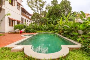 a swimming pool in the yard of a house at La Selva - 4BHK Luxury Villa in Assagao with Private Pool near Cafés & Soro Pub in Assagao +66 photos