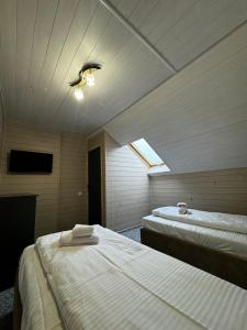 Voodi või voodid majutusasutuse Imperial Hotel toas