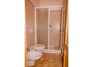 a bathroom with two toilets and a shower at Casa Aurora in Cannobio +3 photos