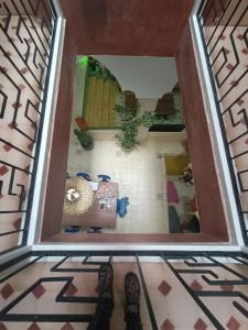 a view from the top of a room with a tile floor at Riad d'exception vue mer au coeur de la médina Essaouira - Mandji Dream in Essaouira