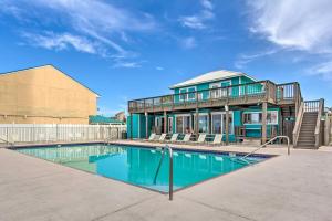 a house with a swimming pool in front of a house at Cozy 2-bedroom townhouse with 11 pools in Panama City Beach