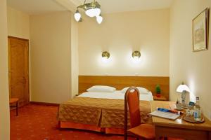 Postel nebo postele na pokoji v ubytování Hotel Regent