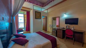 Voodi või voodid majutusasutuse Jamia Central Hotel toas
