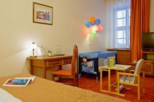 TV a/nebo společenská místnost v ubytování Hotel Regent