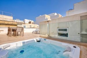 a swimming pool on the roof of a building at Impressive 3 bedrooms, sun terrace, jacuzzi AMRA1-1 in Sliema