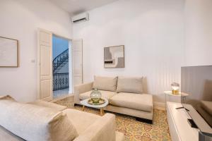 a living room with a couch and a table at Impressive 3 bedrooms, sun terrace, jacuzzi AMRA1-1 in Sliema