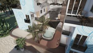 an overhead view of a house with a swimming pool at Cher resort Maldives in Kamadhoo