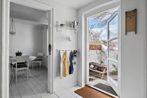 an open door to a dining room with a table at 4221-Stege-Langgade-21 in Stege +16 photos