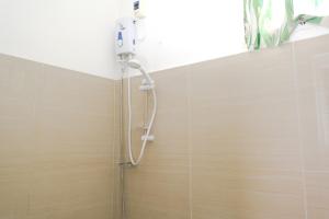 a shower in the corner of a bathroom at Monaliza Surf Resort La Union in San Juan +110 photos
