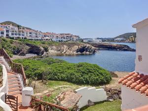 a view of a body of water with buildings at Roca Fornells, Un rinconcito en el mar P107 in Fornells