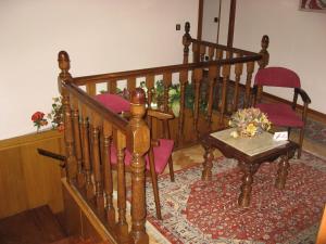 a living room filled with furniture and decorations at Hostal Maria Cristina in Madrid