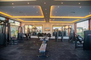 a gym with treadmills and machines in a room at Rewaya Majestic Resort in Hurghada