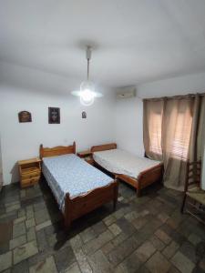Ένα ή περισσότερα κρεβάτια σε δωμάτιο στο Traditional house at Mani