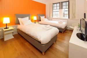 Tempat tidur dalam kamar di Grasshopper Hotel Glasgow