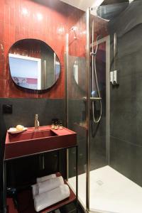 a bathroom with a red sink and a shower at Sol hotel St Mande - 4 personnes - 11 in Saint-Mandé