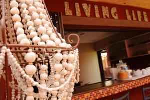 a bunch of white balls hanging from a wall at Skeleton Beach Backpackers in Swakopmund