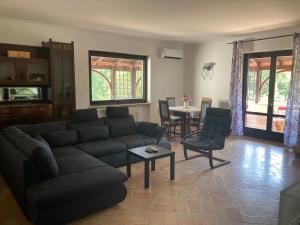 a living room with a couch and a table at Villa Ginevra in Bagnaia