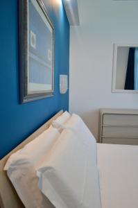 A bed or beds in a room at EGO' Marine