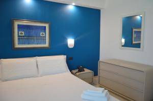 A bed or beds in a room at EGO' Marine