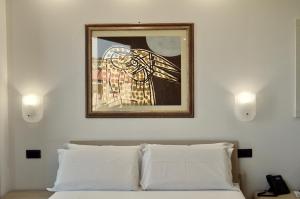 A bed or beds in a room at EGO' Marine
