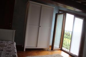 A bed or beds in a room at Lady Frantoio Toscano