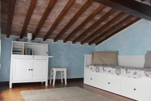 A bed or beds in a room at Lady Frantoio Toscano