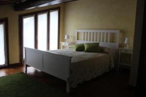 A bed or beds in a room at Lady Frantoio Toscano