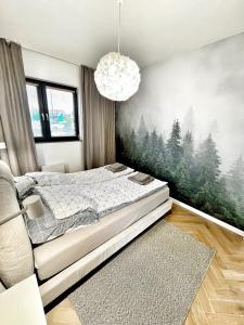 Katil atau katil-katil dalam bilik di Orli Dziób - apartament nad brzegiem z basenem i sauną