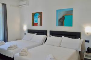 A bed or beds in a room at EGO' Marine