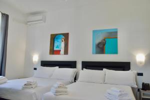 A bed or beds in a room at EGO' Marine