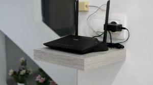 a laptop sitting on top of a stone shelf at Le Fabuleux Mazagran in Mostaganem