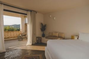 Кровать или кровати в номере VILLA FLAKA Boutique Hôtel Confidentiel et Convivial