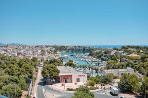 an aerial view of a harbor with boats in the water at Hotel Ankaa - Adults Only in Porto Cristo