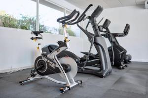 two exercise bikes lined up in a gym at Hotel Ankaa - Adults Only in Porto Cristo