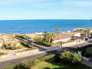 an aerial view of the ocean and a road at Apartamento encantador con piscina y aire acondicionado cerca de la playa de Jávea - ES-160-7 in Jávea