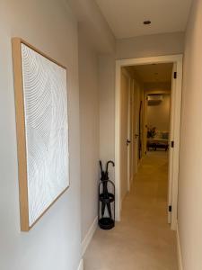 a hallway with a large painting on the wall at B&B De Amsterdamse Poort in Haarlem +9 photos