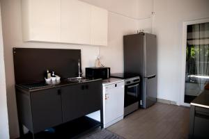 Kuchyň nebo kuchyňský kout v ubytování Beach House Valerija