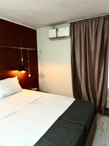 Postel nebo postele na pokoji v ubytování Hotel New Terrace + 71 fotografií