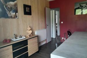 a kitchen with a sink and a refrigerator at Ski in and ski out apartment Superdévoluy in Le Dévoluy