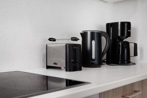 Příslušenství pro přípravu čaje a kávy v ubytování Das Strandhaus am Dümmer See