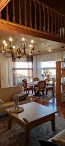 a living room with a couch and a table at Lavendel Apartman in Harkány