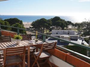 a balcony with a table and chairs and the ocean at Medas Park 261 - L'Estartit, Centro - ES-323-89 in Torroella de Montgrí