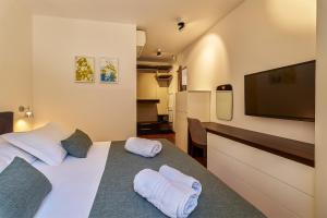 Ένα ή περισσότερα κρεβάτια σε δωμάτιο στο Alba Residence +73 φωτογραφίες