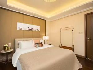 Katil atau katil-katil dalam bilik di Fsmile Viessmann City Resort Suites +7 gambar