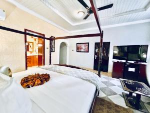 TV o dispositivi per l'intrattenimento presso Coconut Pointe Villa & Beach Resort