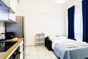 Ένα ή περισσότερα κρεβάτια σε δωμάτιο στο Nettuno80 1 by Casa di Marco AP37