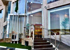 a set of stairs in front of a building at كيان الين للشقق المخدومة in Abha