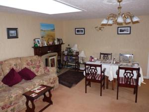 a living room with a table and a couch at The Mill Bar in Athlone