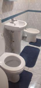 a bathroom with a toilet and a sink at Vila Elio in Pogradec